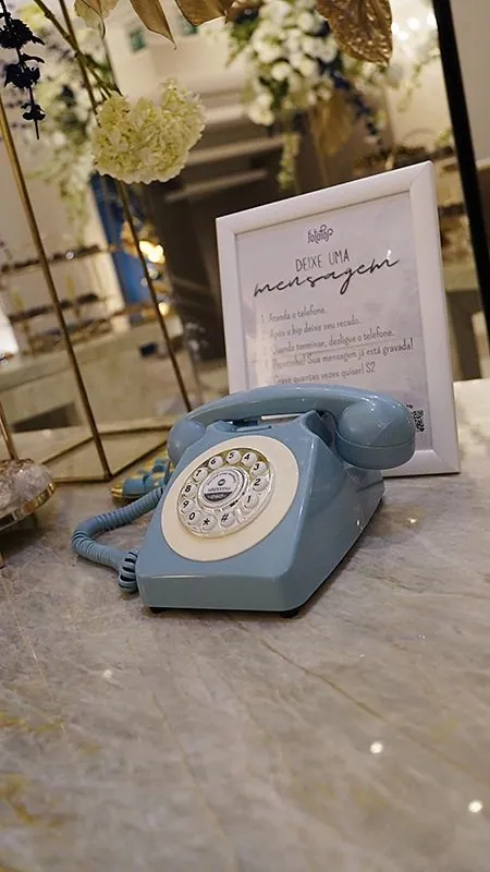 Telefone retrô azul com a placa Deixe uma mensagem